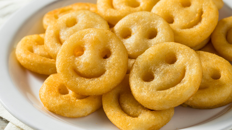 Pile of potato smileys on plate