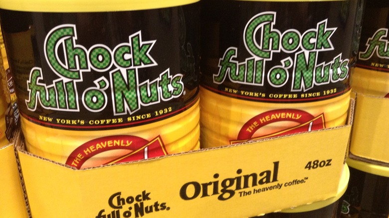 cans of Chock Full o' Nuts coffee shown in a retail display