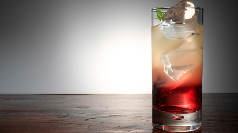 cocktail with creme de cassis in a tall glass
