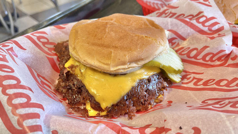 Triple Steakburger on a paper wrapper