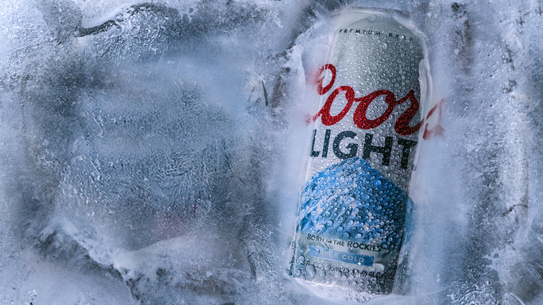 Can of Coors frozen in a block of ice