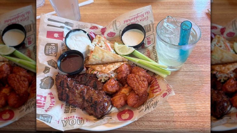 Applebee's appetizers on plate with drink
