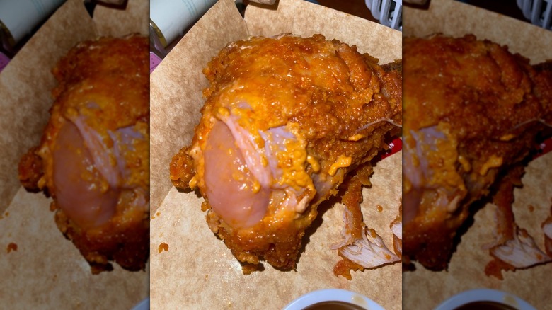 Mirrored image of raw chicken from Jollibee