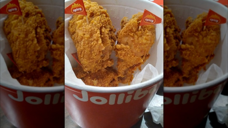 Mirrored image of Jollibee chicken in bucket