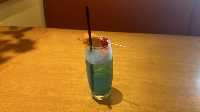 Blue Capri cocktail from Olive Garden on wooden table