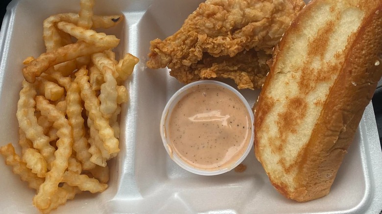 Fries, chicken, and Texas toast in container