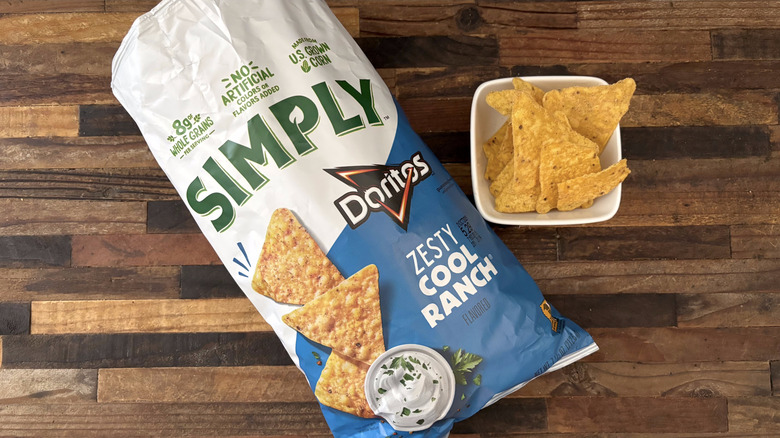Simply Zesty Doritos Cool Ranch in bag and white bowl on wooden table