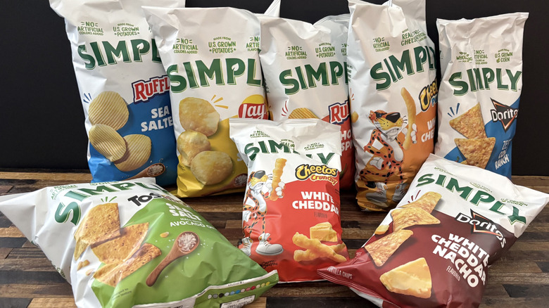 A variety of Frito-Lay Simply chips on a wooden table