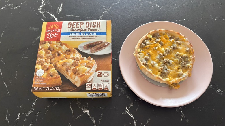 Aldi deep dish breakfast pizza box next to breakfast pizza on plate