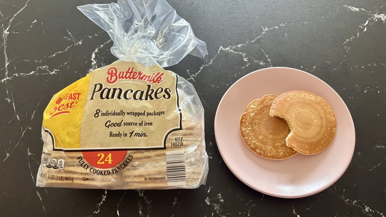 Aldi buttermilk pancake package next to pancakes on plate