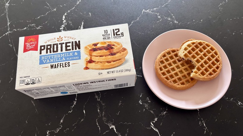 Aldi protein waffles box next to plate with waffles