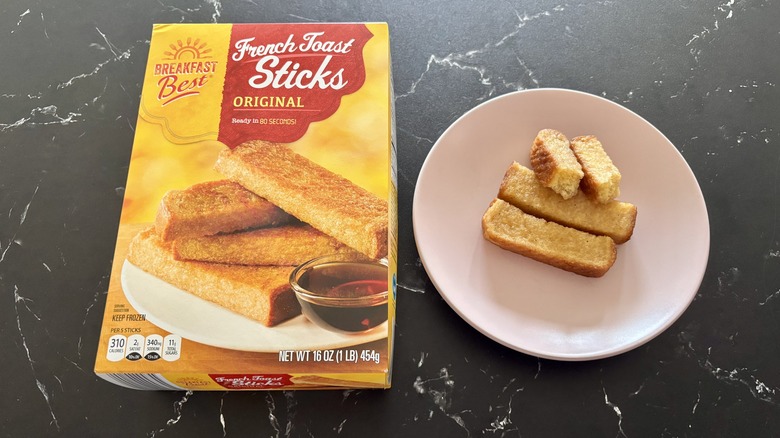 Aldi French toast sticks box next to French toast sticks on plate