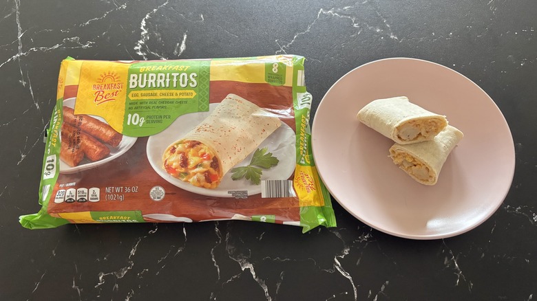 Aldi breakfast burrito package next to burrito on plate