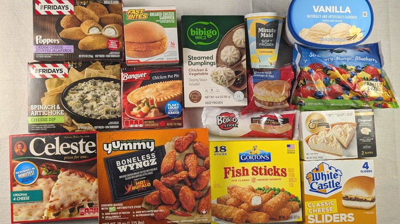 A variety of boxes and containers of frozen food from Dollar Tree on a white tablecloth