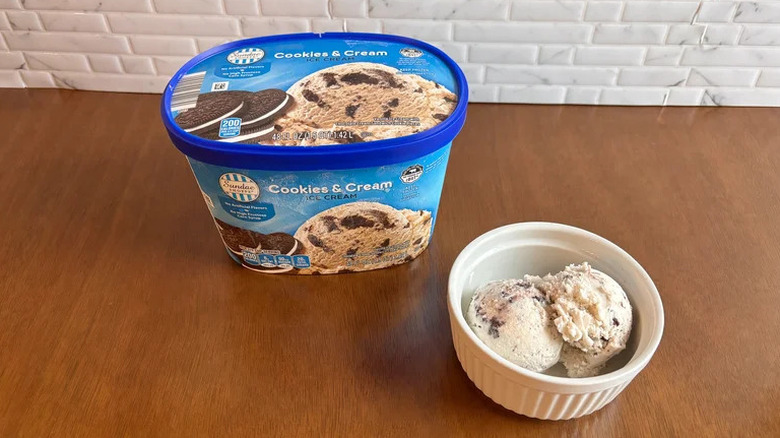 Sundae Shoppe cookies and cream ice cream in container and bowl on table