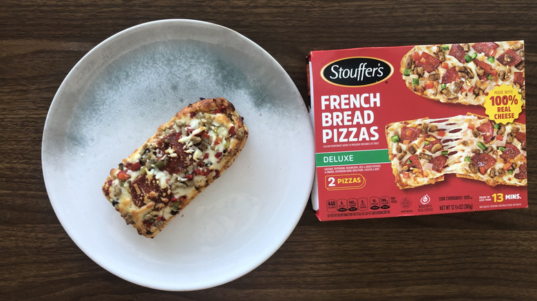 Stouffer's French bread deluxe pizza on a plate.