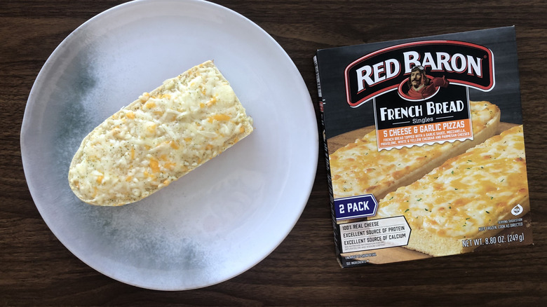 Red Baron French bread 5 cheese and garlic pizza on a plate.
