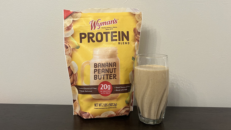 Wyman's banana peanut butter protein smoothie in a glass.