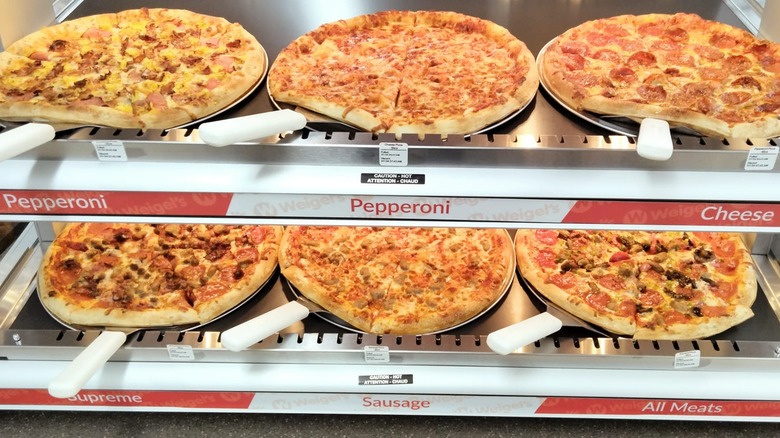 Six Weigel's pizzas in hot bar