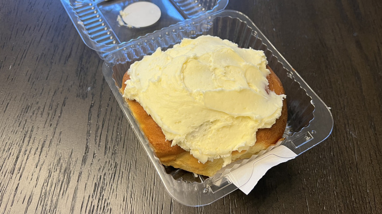 Giant Eagle cinnamon roll with cream cheese icing in plastic container