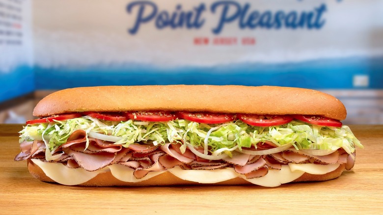 Giant Jersey Mike's sub on wooden table