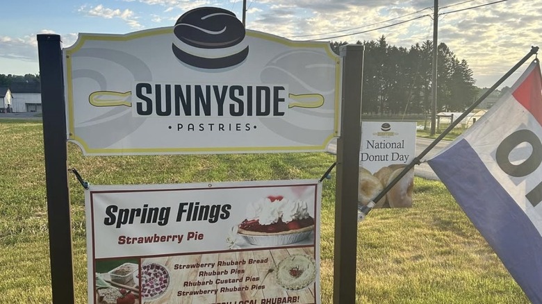 Sign advertising Sunnsyide Pastries with an open flag