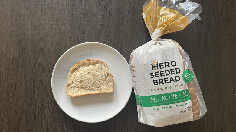 Slice of Hero Seeded bread on a plate.