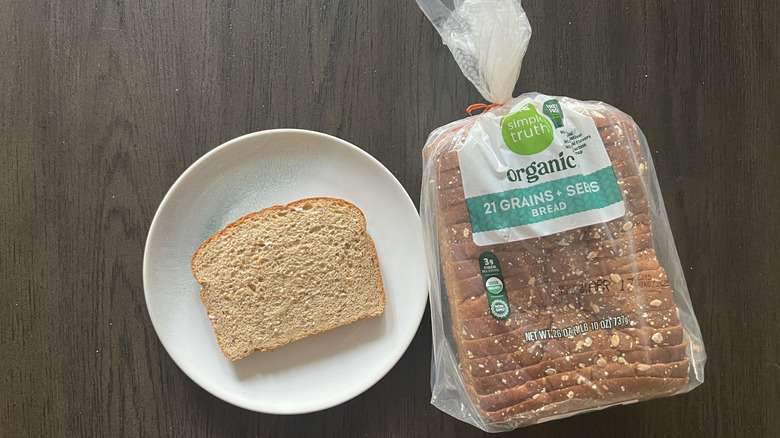 Slice of Simple Truth Organic 21 Grains + Seeds bread on a plate.