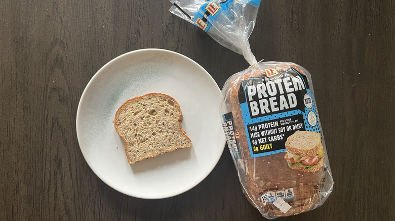 Slice of L'Oven Fresh high protein bread on a plate.