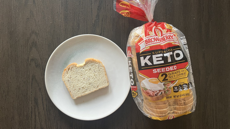 Slice of Brownberry Keto Seeded bread on a plate.