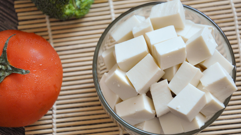Cubes of silken tofu in a glass bowl