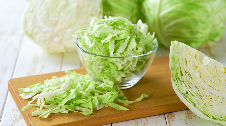 Freshly sliced green cabbage in small glass bowl