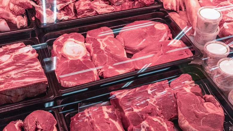 Fresh raw meat in plastic packaging in store