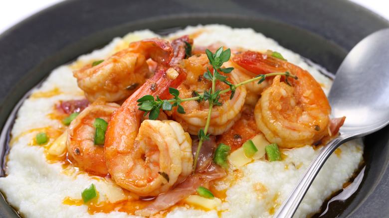 close up of Shrimp and grits in bowl with spoon