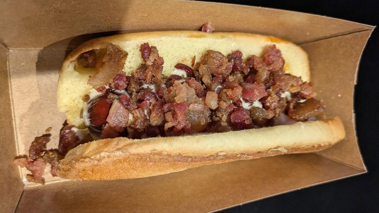 Hot Maple and Bacon Hot Dog in brown paper tray