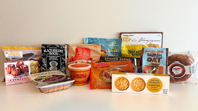 Various packaged international foods from Trader Joe's on a white surface