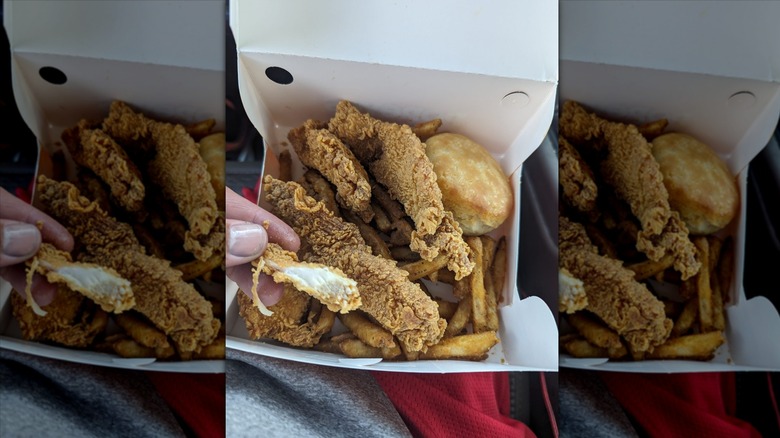 Popeyes chicken tenders, fries, and biscuit in paper box
