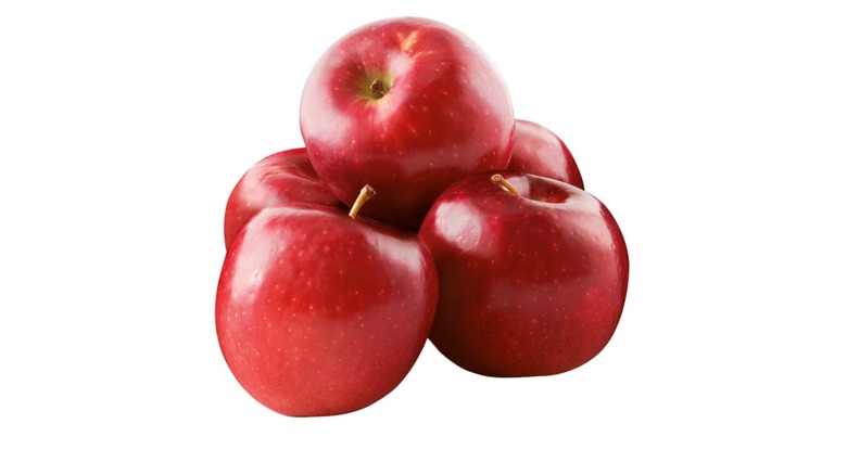 five apples on white background