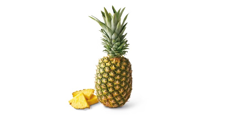 whole pineapple and cut pieces