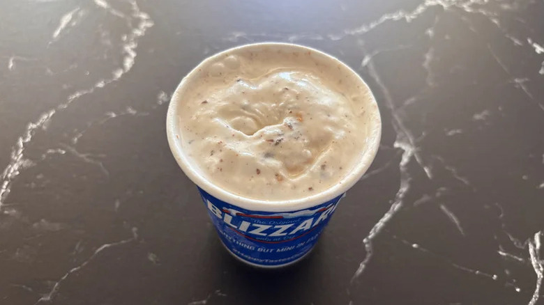 Heath Blizzard in a cup top view on a black marble surface