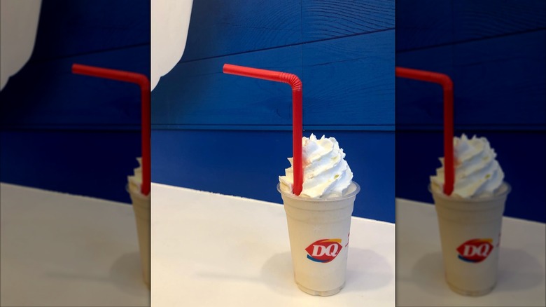 MooLattes from Dairy Queen in cup with a red straw and a blue background