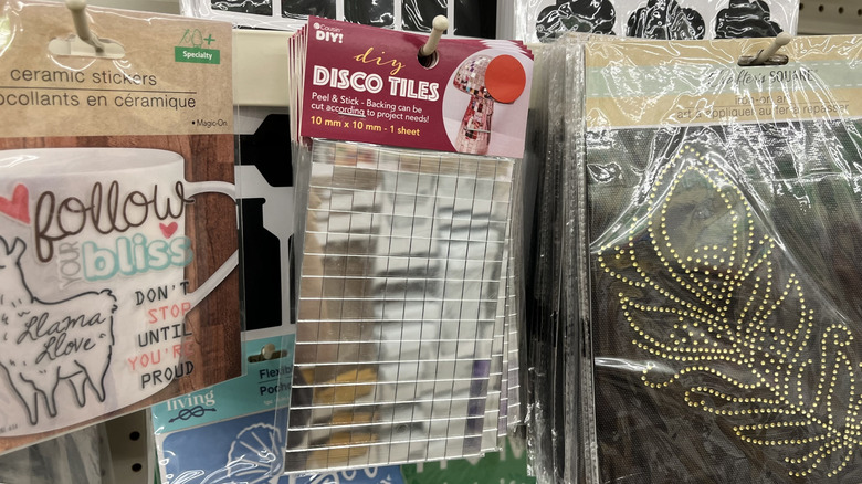 Packages of peel-and-stick disco tiles at Dollar Tree
