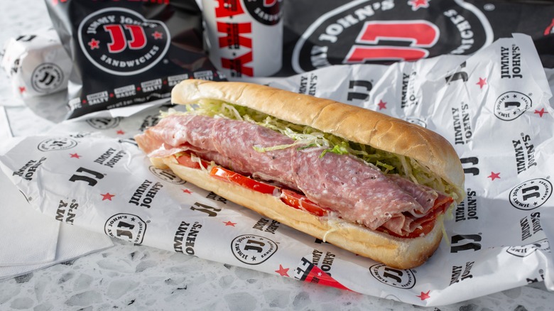 Jimmy John's sandwich with salami on paper wrapper