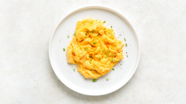 Scrambled eggs on white plate