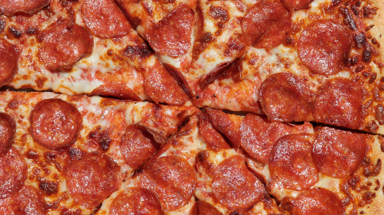 Pepperoni pizza cut into slices
