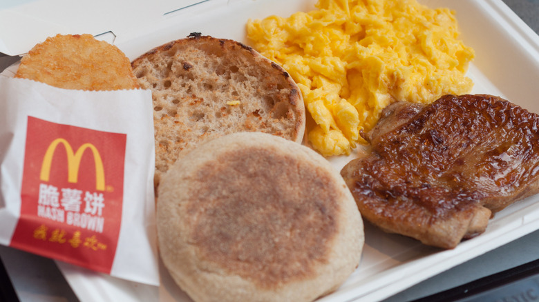 McDonald's hashbrown muffin sausage and scrambled eggs on tray
