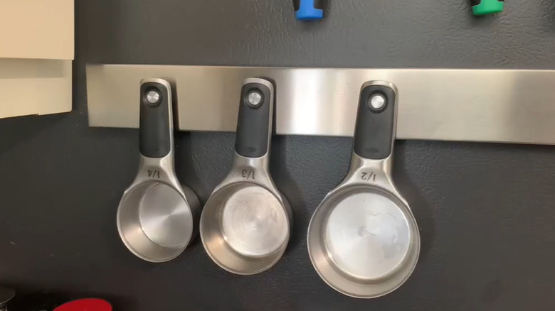 Measuring cups on magnetic knife strip