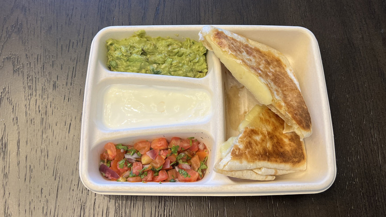 Chipotle cheese quesadilla with guac, sour cream, and tomato salsa.
