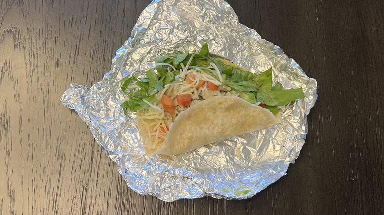 Chipotle veggie taco with tomatoes, lettuce, and cheese.