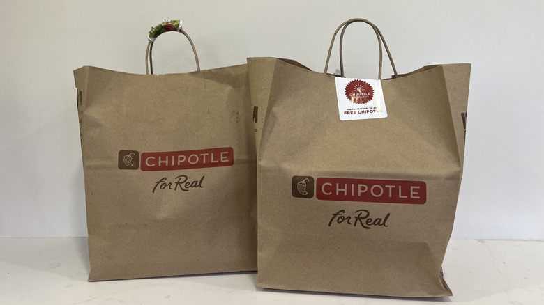 Two large Chipotle to-go bags.